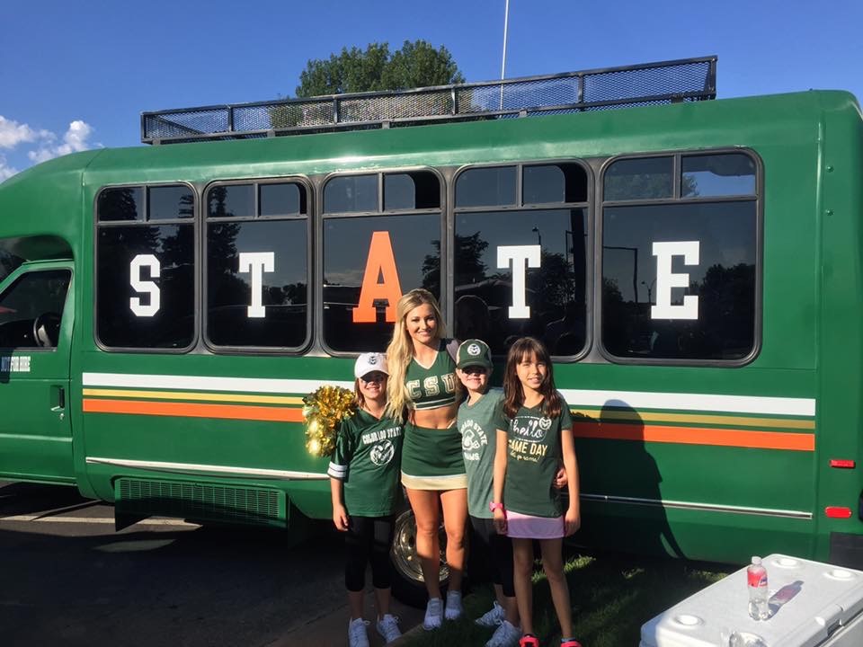 Bus with cheerleader and girls