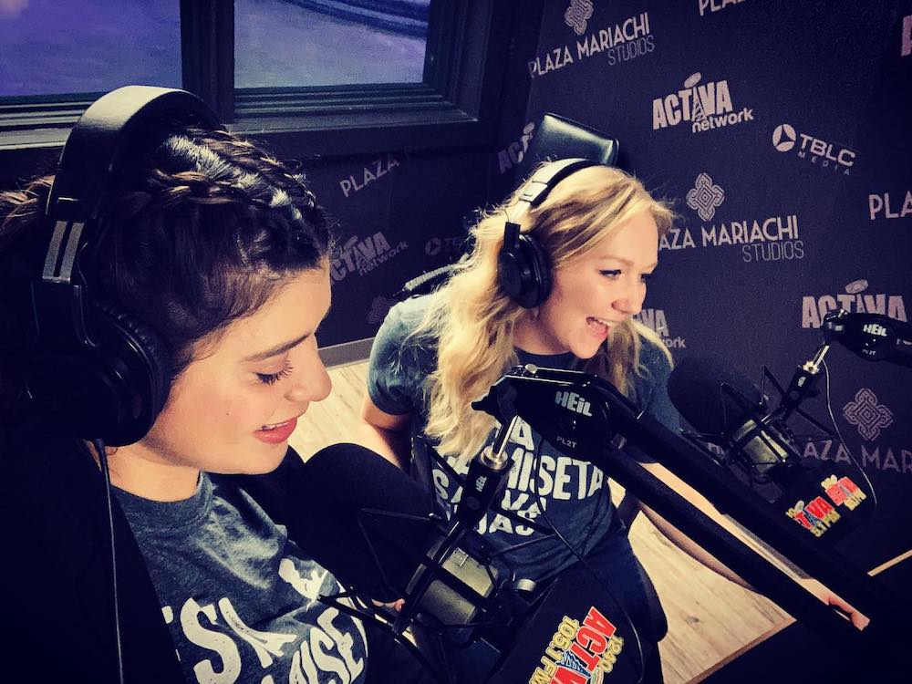 Two women in headphones in a radio studio