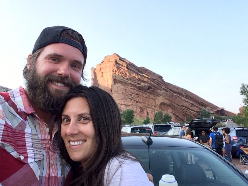Couple with red rock formations in background