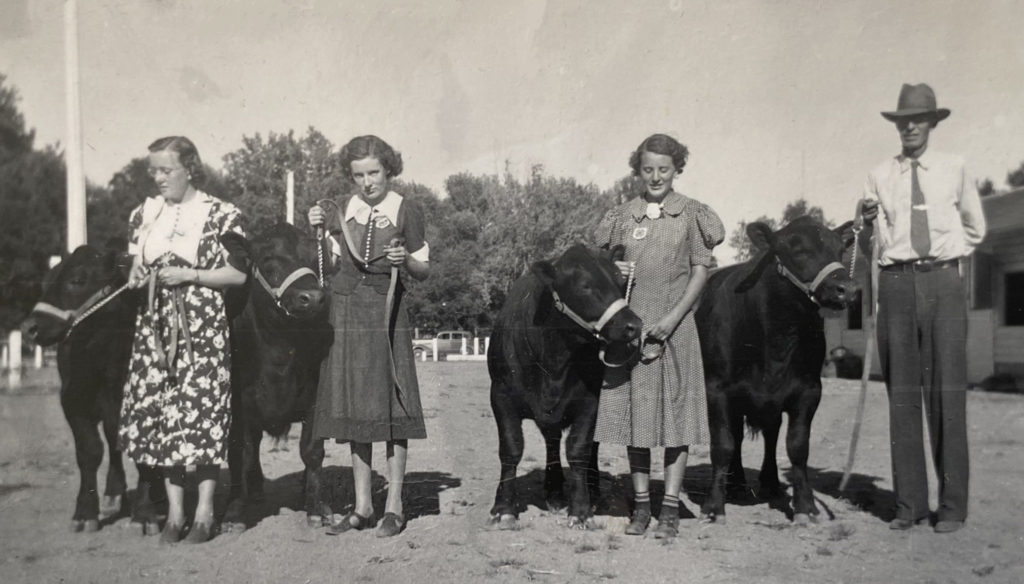 Shirley Stanosheck at the Colorado State Fair in 1937 with her prized steer named Peter.