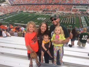 Larson Family in stands at Canvas Stadium during football game