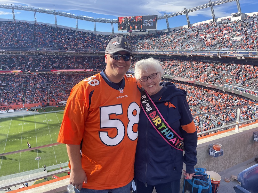 Scott Burke with his mom at a Broncos game at Mile High Stadium stands
