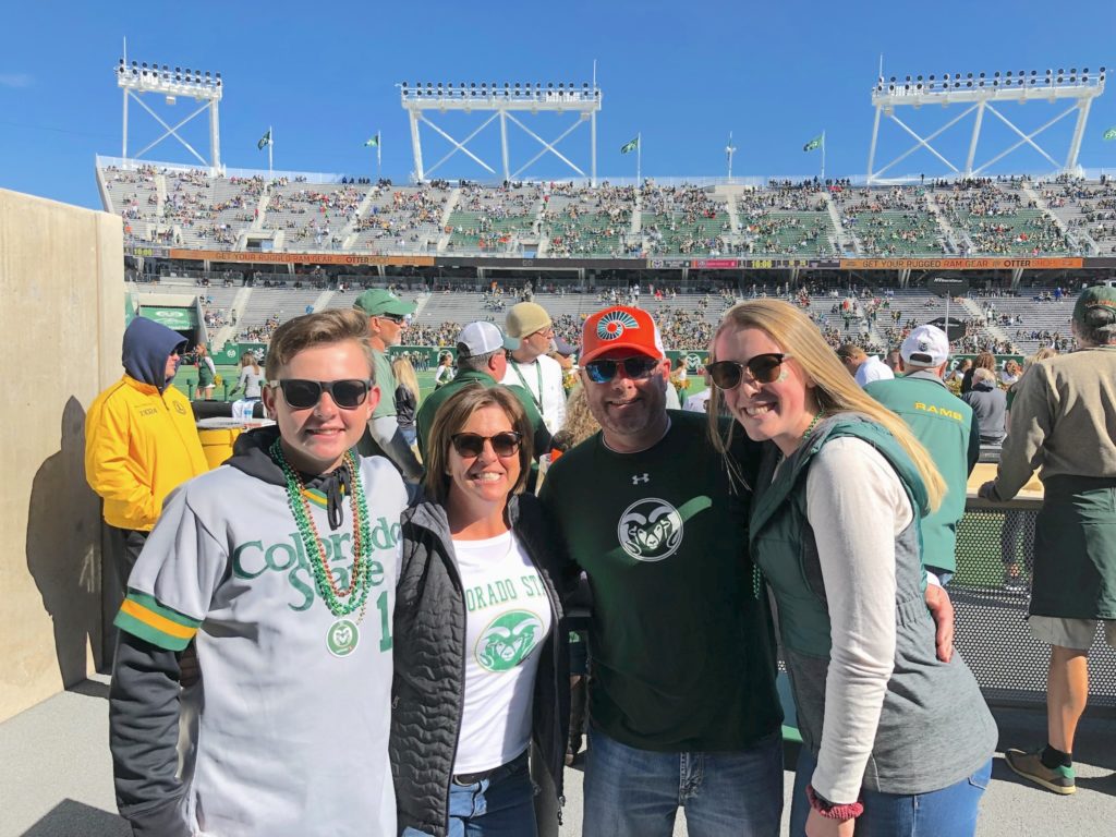 The Heap family (Brad, Beth, Matt, and Taylor) attending a Rams game at Canvas Stadium