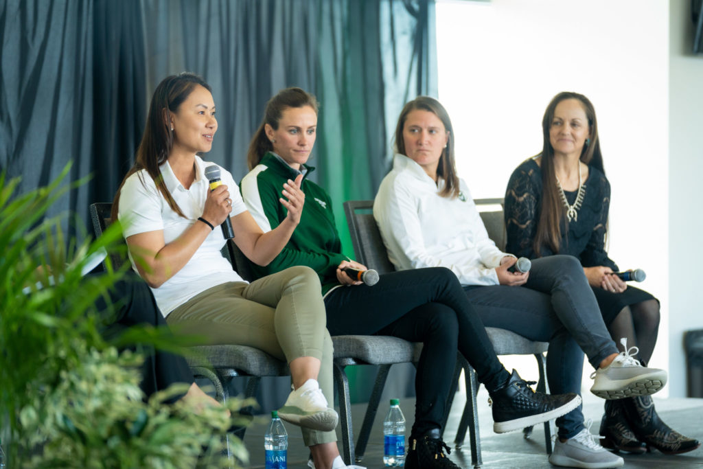 Mai-Ly Tran, Keeley Hagen, Laura Cilek, and Jen Fisher on stage during a Woman and Philanthropy event 