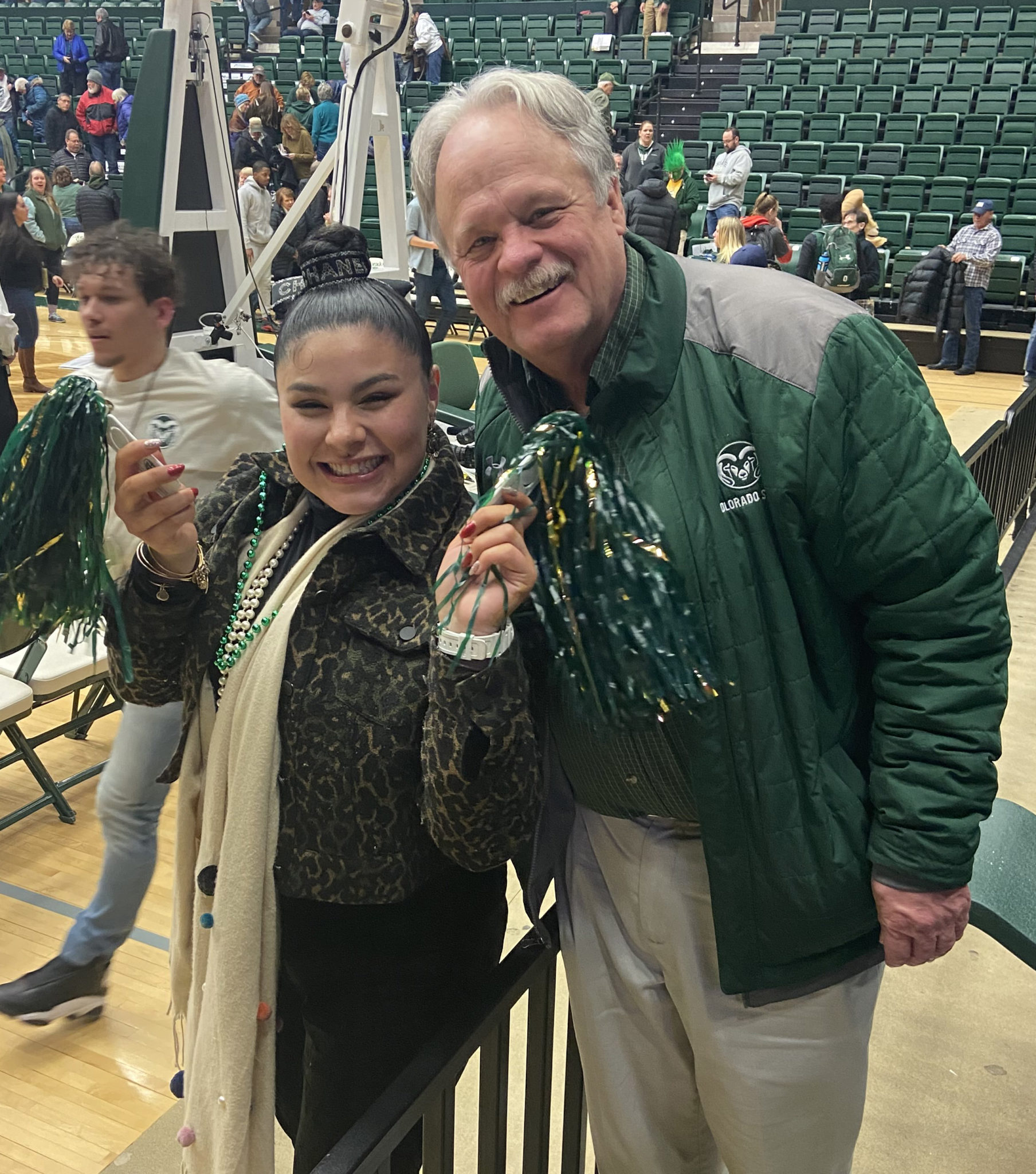 Kevin Keefe with Tia Nuanez, a student studying agricultural sciences, at a CSU Women's Basketball game celebrating the Fostering Success Program in February 2020.