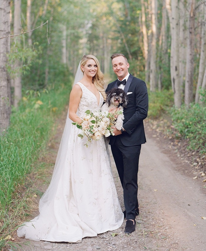 Kaitlin Moss with her husband at their wedding
