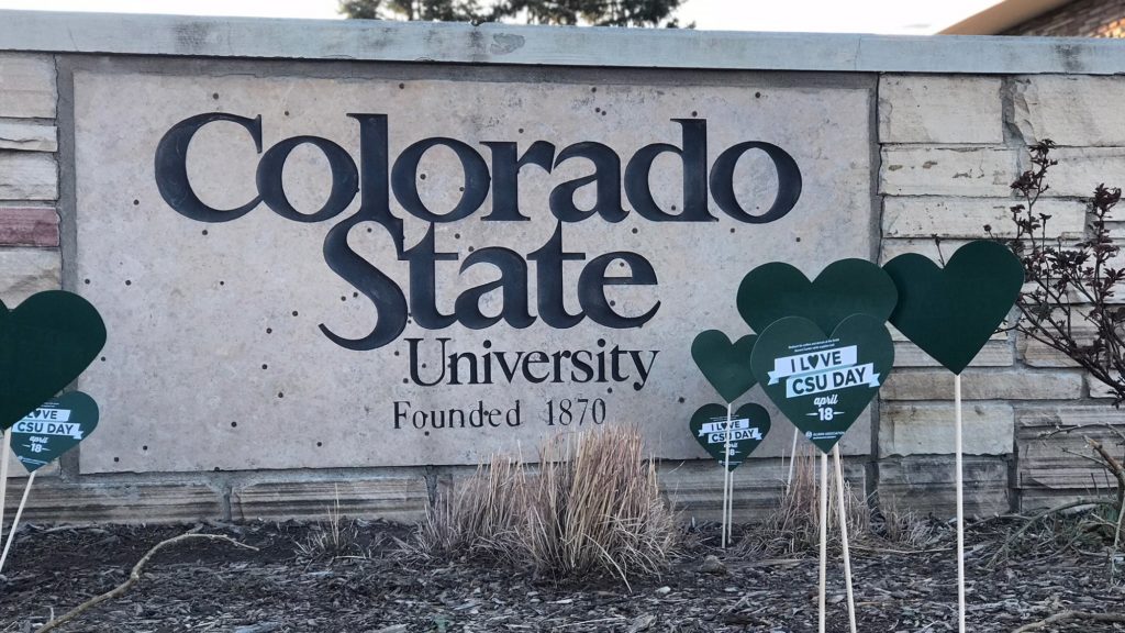 The Colorado State University sign surrounded by green hearts signifying I Love CSU Day 