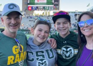 Bart and Jennifer Deming with their children after a CSU football game in October 2022.