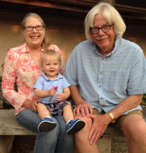 Ann and Mike with grandson, Emmett.