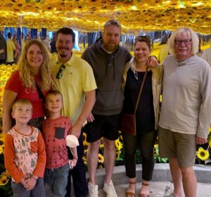 The Liggett family in 2022 at the Van Gogh Alive exhibit in Denver (from left to right): Grant, Sarah, Emmett, Jason, Morgan, Stephanie, and Mike.
