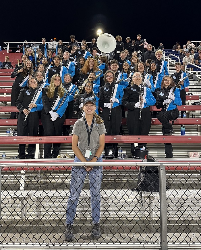 Kathryn Kennedy with students as Pueblo West High School band director