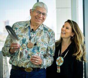 Cherokee Nation Elder John Gritts (left) with Stiles participate in a blessing ceremony at the Spur campus in June 2022.