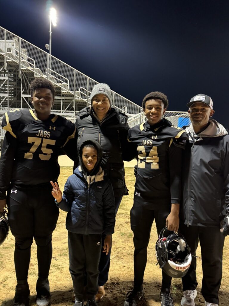 Ronald and Zenarae Antoine with their three sons at a high school football game. 