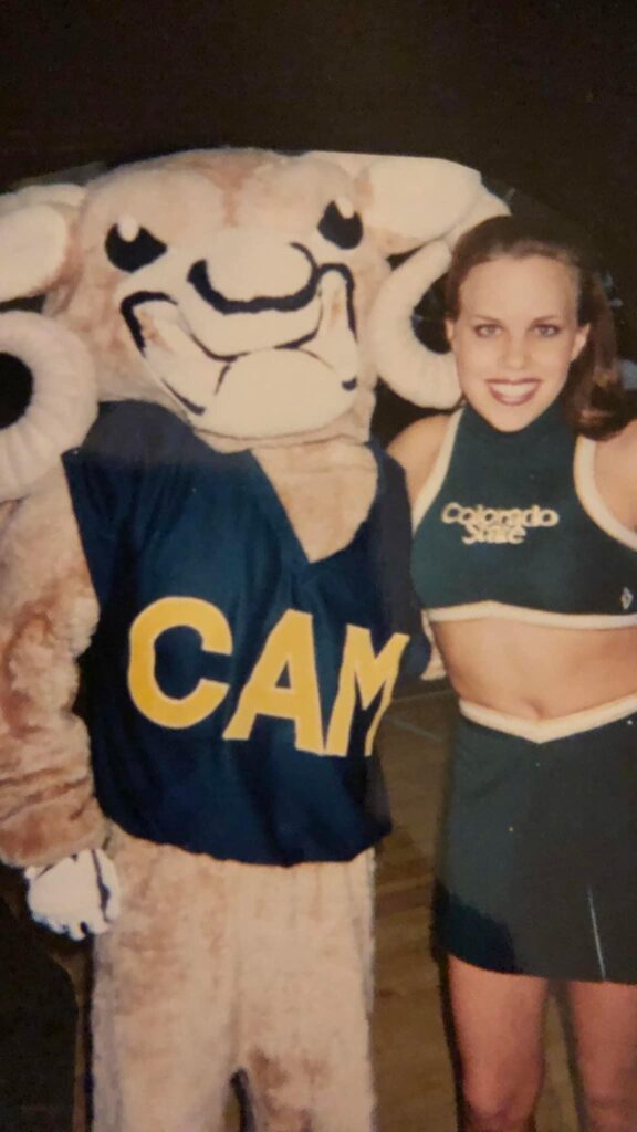 A young Angela Fuller standing beside Spirit CAM