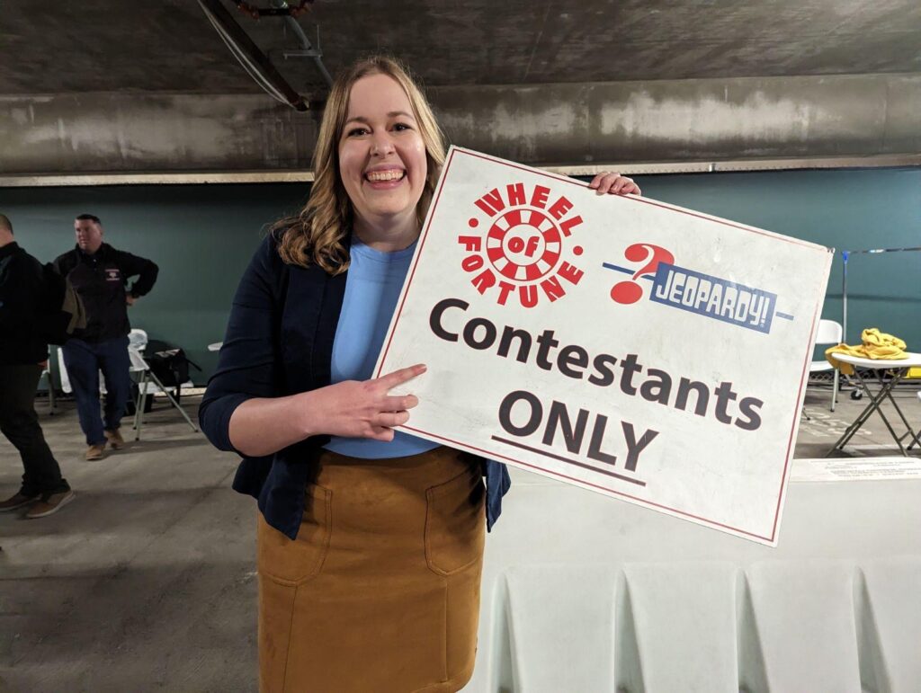 Marissa Rogers holding a contestants only sign backstage. 