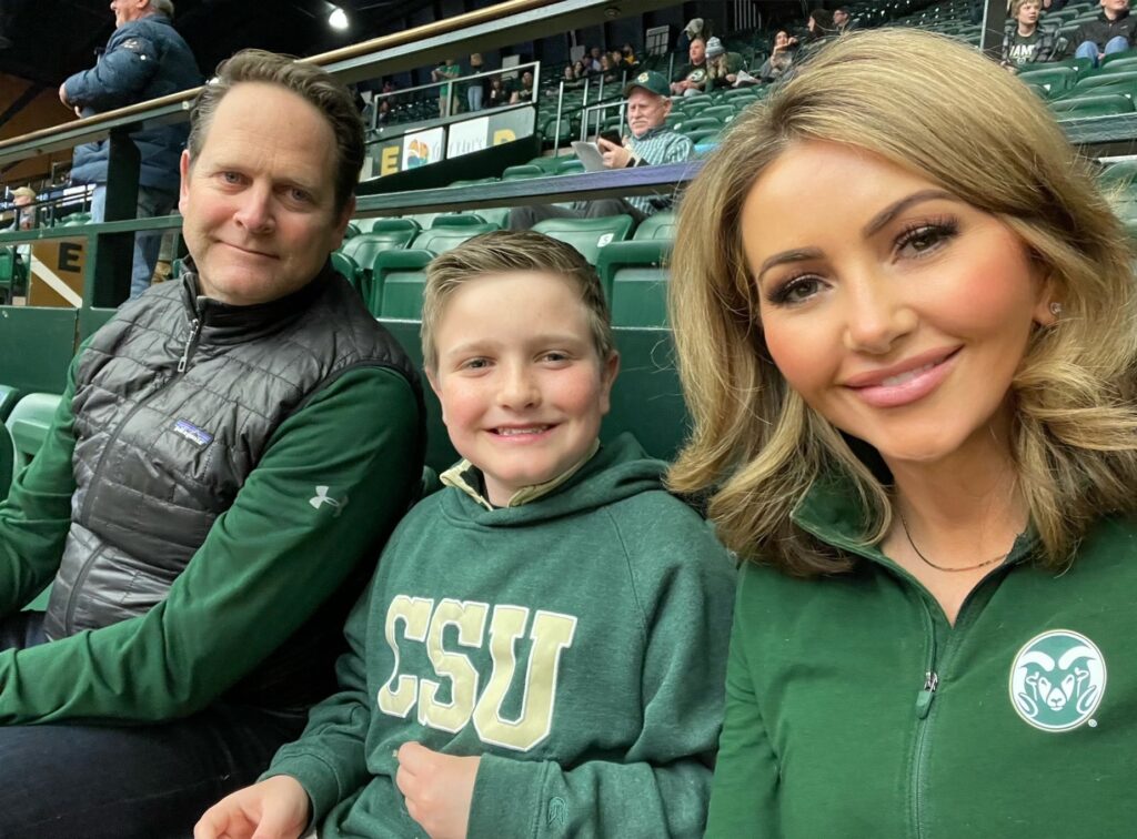 Kathleen Pitre (right) with her family ready to watch the Rams basketball game in Moby Arena. 