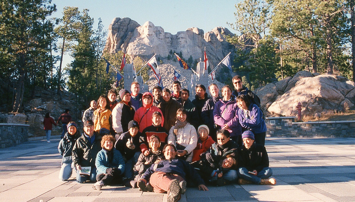 Robert and Nancy Sturtevant with international students by Mount Rushmore